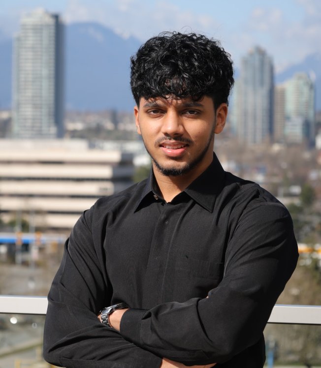 Ahmed Raza, founder of Layl Mocktails & Events, with the Vancouver skyline behind him